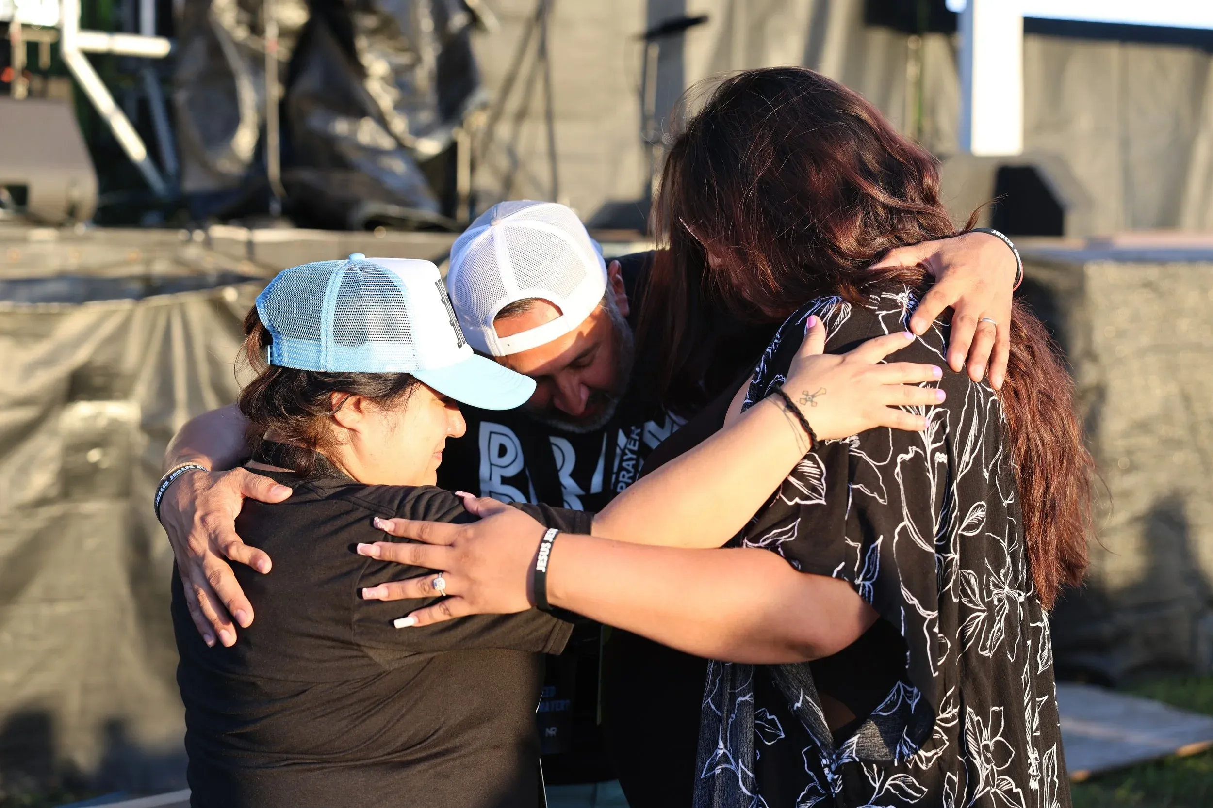 An embrace after a baptism at The Field